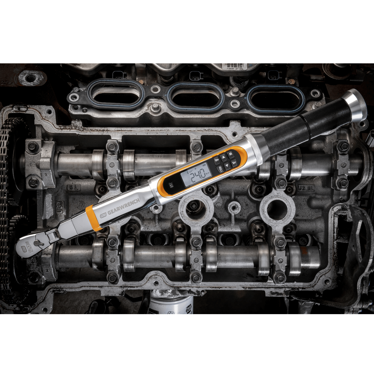 Image of GEARWRENCH 85194 Electronic Torque Wrench in front of an engine block