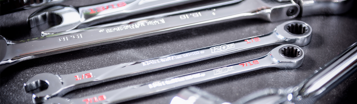 GEARWRENCH 120XP ratcheting wrenches sitting on top of a rolling cabinet